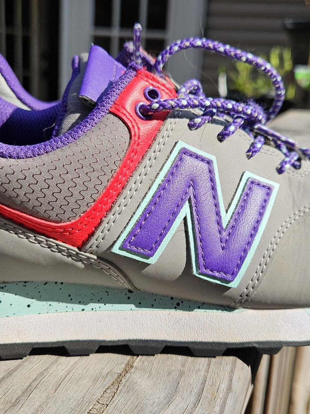 Women's Gray New Balance Sneakers with Purple and Teal Accents